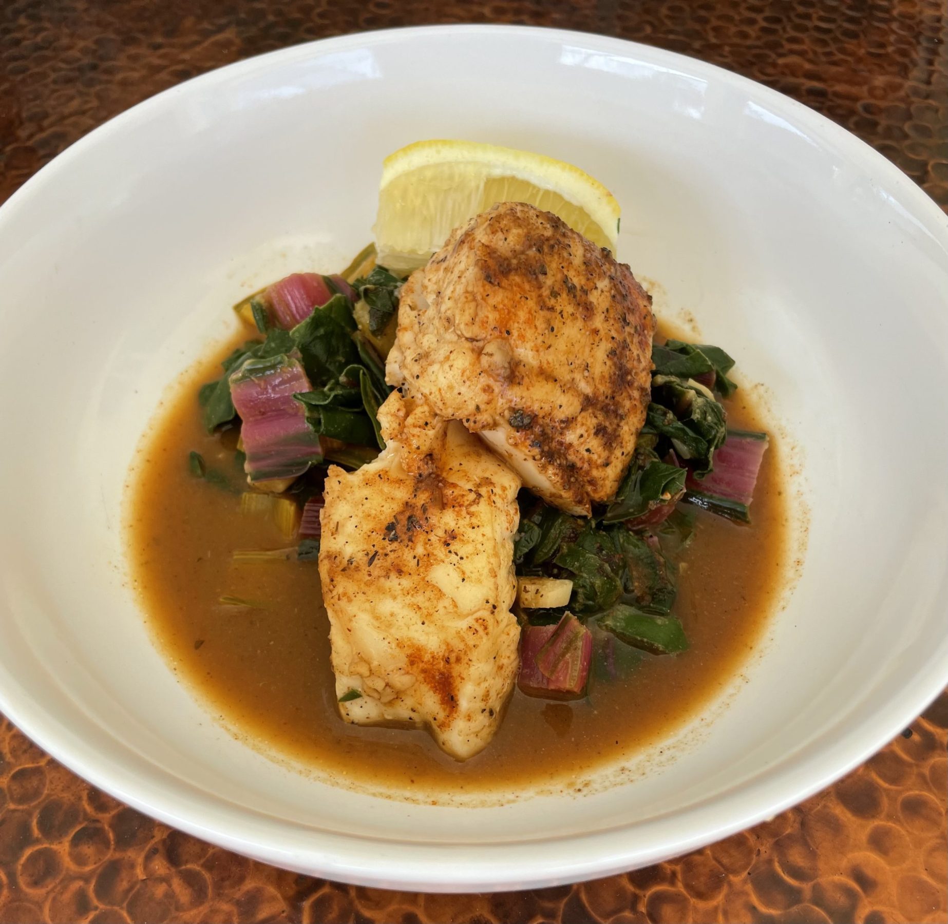 Seasoned Seabass over Sauteed Rainbow Swiss Chard